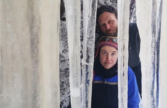 Photo of Amy and Dave freeman looking through icicles