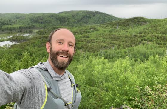 Selfie of Alex Falconer overlooking Boundary Waters