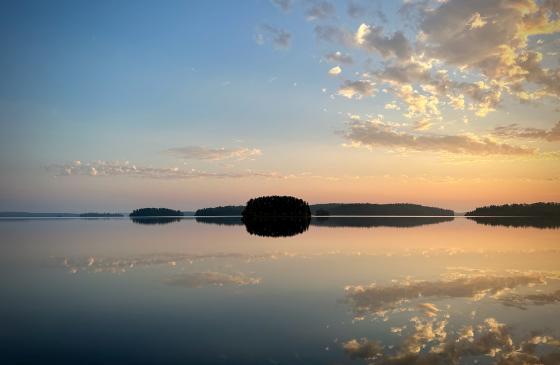 Morning light over water and Quetico.