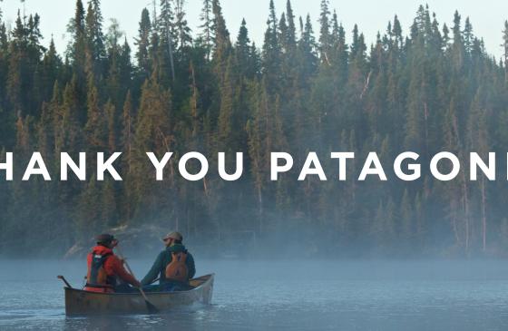two people paddling a canoe and the text above reading Thank You Patagonia